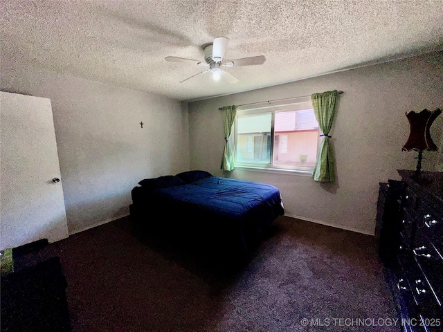 bedroom with ceiling fan, a textured ceiling, and carpet flooring