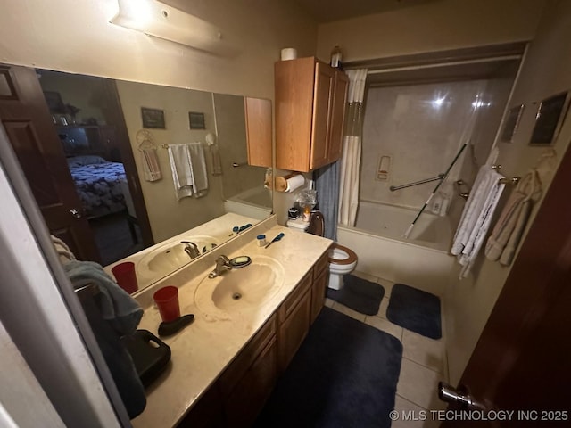 full bathroom featuring shower / tub combination, vanity, toilet, and tile patterned floors