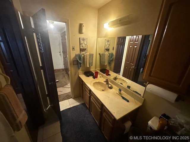 bathroom with vanity and tile patterned floors