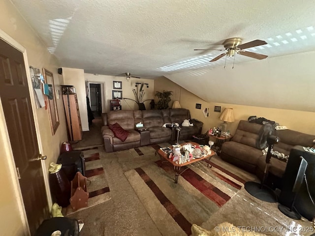 living room with lofted ceiling, ceiling fan, and a textured ceiling