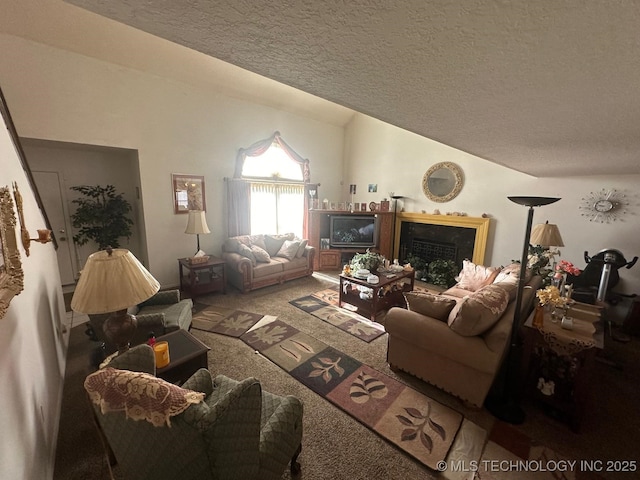 carpeted living room with lofted ceiling, a fireplace, and a textured ceiling