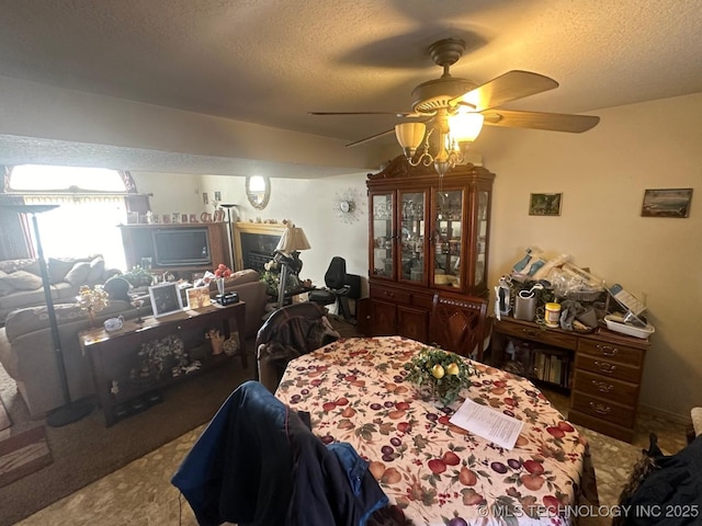 dining area with a textured ceiling and carpet flooring