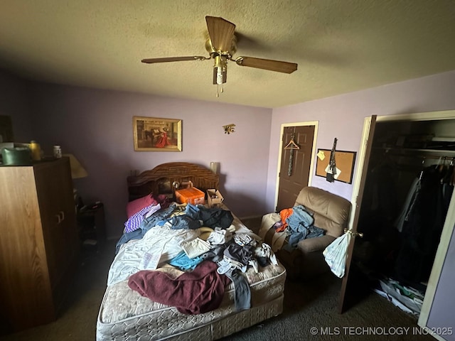 carpeted bedroom with a ceiling fan and a textured ceiling