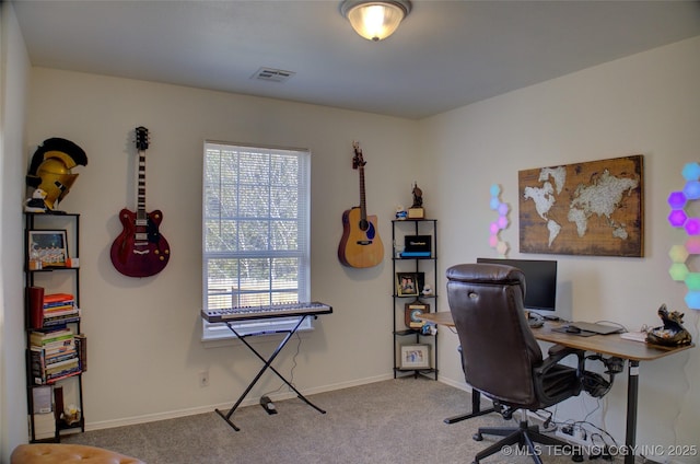 carpeted home office featuring visible vents and baseboards