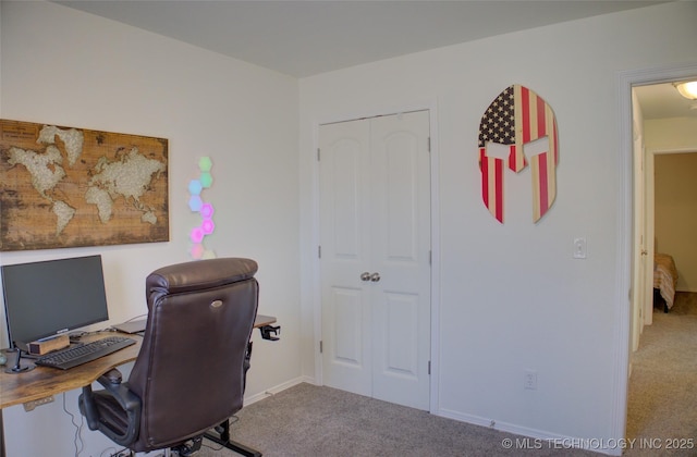 carpeted office featuring baseboards