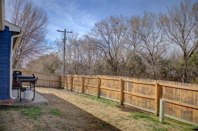 view of yard with a fenced backyard