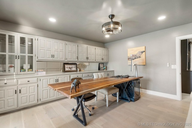 home office featuring baseboards, recessed lighting, and light wood-style floors