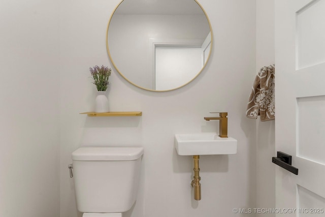 bathroom with a sink and toilet