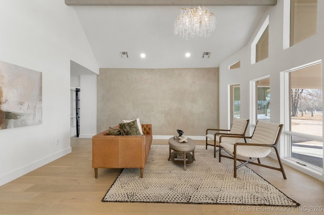 interior space featuring baseboards, visible vents, and wood finished floors