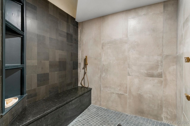 full bathroom with tiled shower