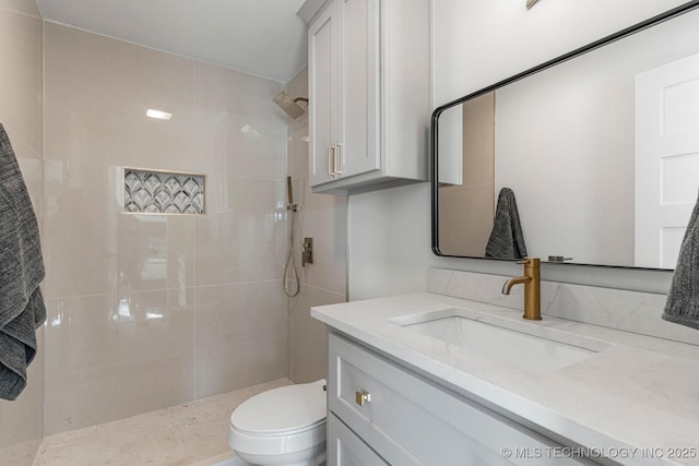 full bathroom featuring vanity, toilet, and walk in shower