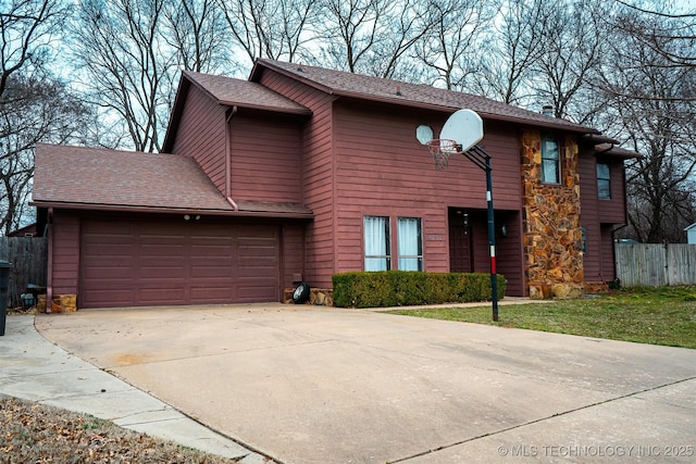 view of front of home with concrete driveway, roof with shingles, an attached garage, and fence