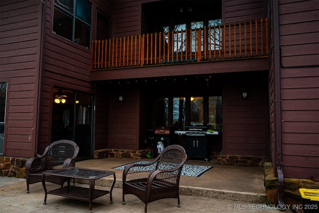 view of patio / terrace with a balcony and area for grilling