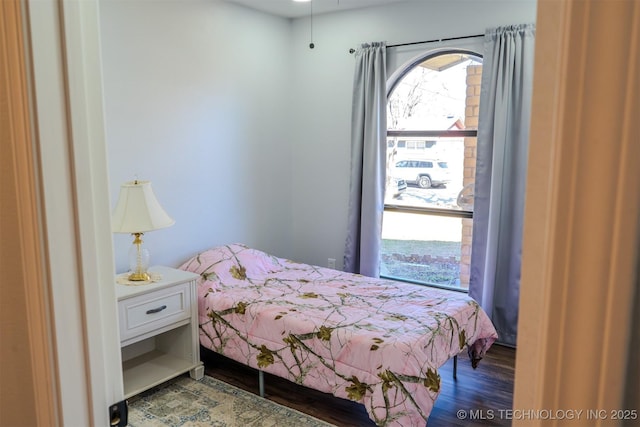 bedroom featuring wood finished floors