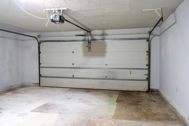 parking garage featuring baseboards and a garage door opener