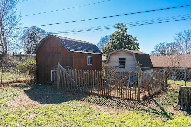 view of shed featuring fence