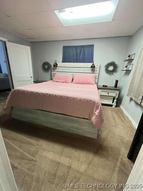 carpeted bedroom with baseboards