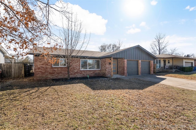 ranch-style house featuring a garage, board and batten siding, concrete driveway, and brick siding