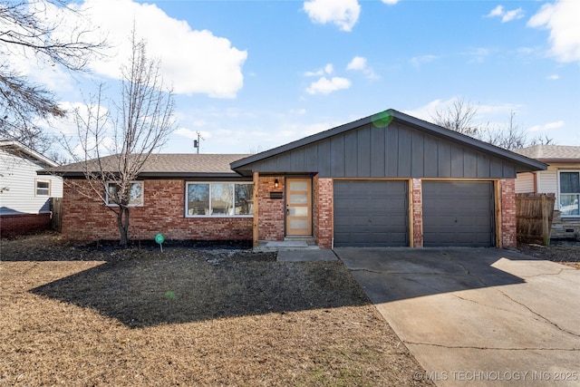 view of front of property with an attached garage, driveway, roof with shingles, and brick siding