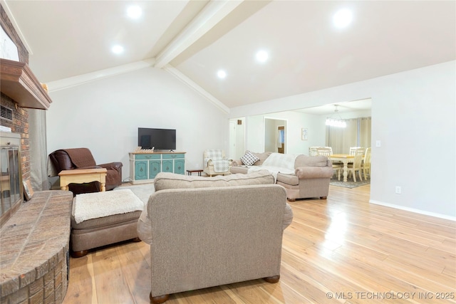 living area featuring a fireplace, vaulted ceiling with beams, recessed lighting, light wood-type flooring, and baseboards