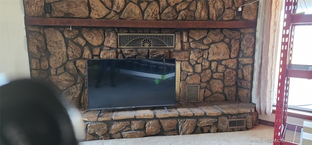 room details with carpet floors, a fireplace, and visible vents