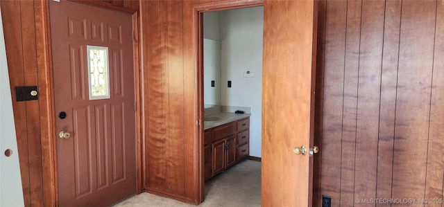 interior space with wooden walls and vanity