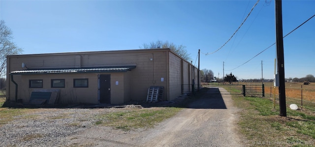 exterior space with driveway and fence