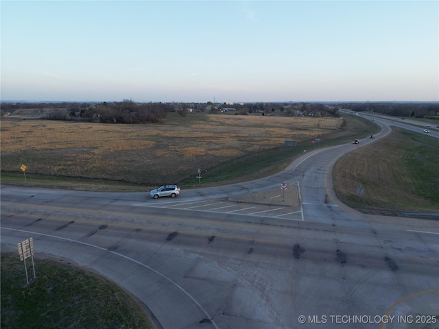 birds eye view of property with a rural view