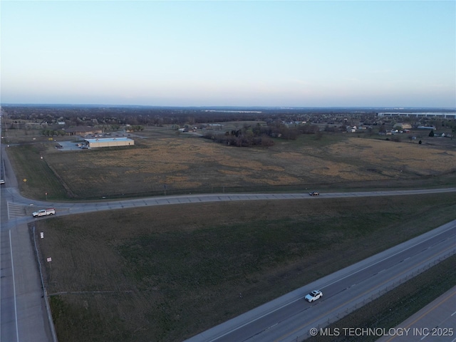 birds eye view of property with a rural view