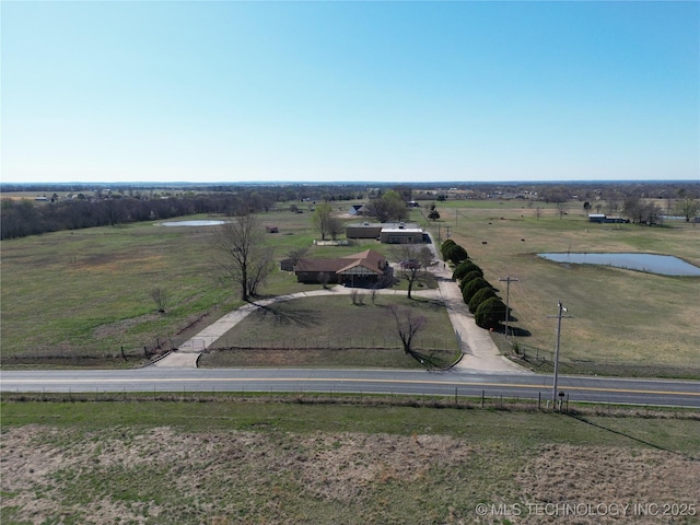 aerial view with a rural view and a water view