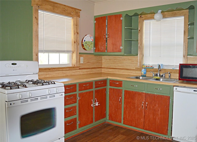 kitchen featuring white appliances, a sink, light countertops, open shelves, and dark wood finished floors