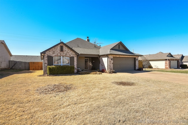 view of front of house with an attached garage, fence, driveway, roof with shingles, and a chimney