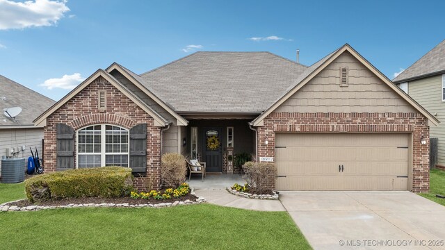 view of front facade with driveway, brick siding, and an attached garage