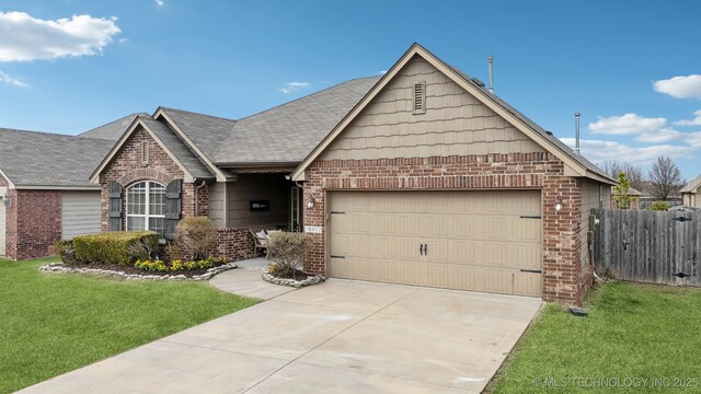 view of front of house featuring an attached garage, brick siding, fence, concrete driveway, and a front lawn