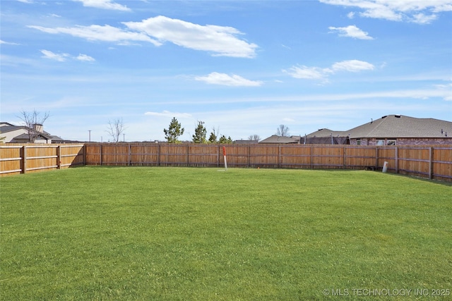 view of yard featuring a fenced backyard