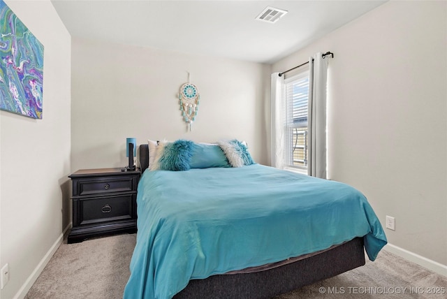 bedroom featuring carpet, visible vents, and baseboards