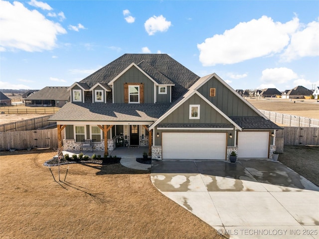 craftsman house with driveway, a porch, roof with shingles, and fence