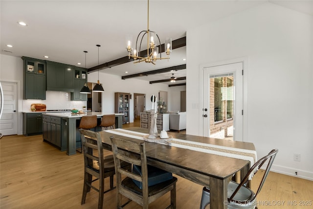 dining room featuring recessed lighting, light wood-type flooring, beamed ceiling, baseboards, and ceiling fan with notable chandelier