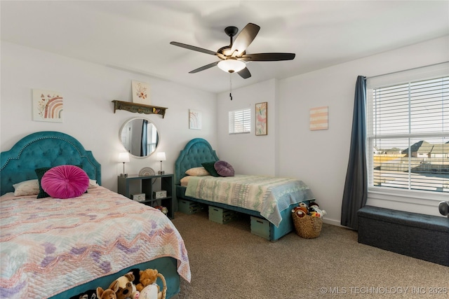 bedroom with ceiling fan and carpet
