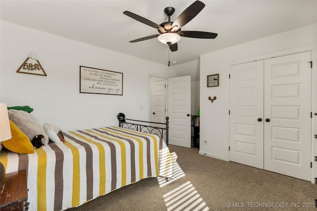 bedroom featuring carpet floors, a closet, and a ceiling fan