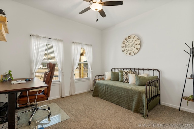 carpeted bedroom with baseboards and a ceiling fan