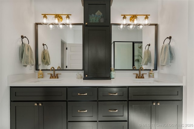 full bathroom featuring double vanity, a shower, and a sink