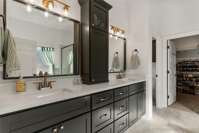 bathroom featuring double vanity and a sink