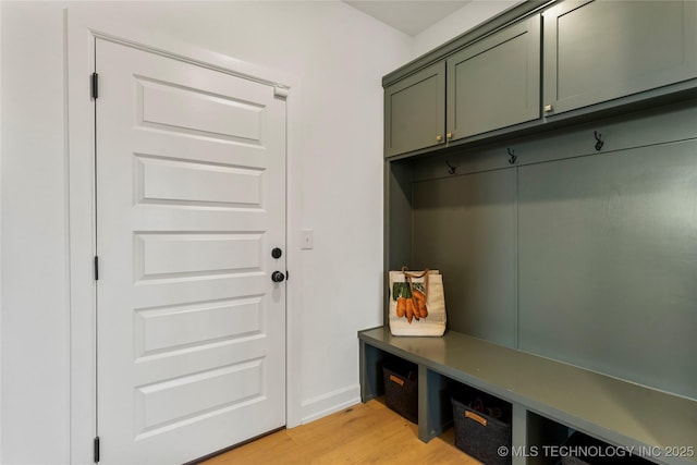 mudroom with light wood-type flooring and baseboards