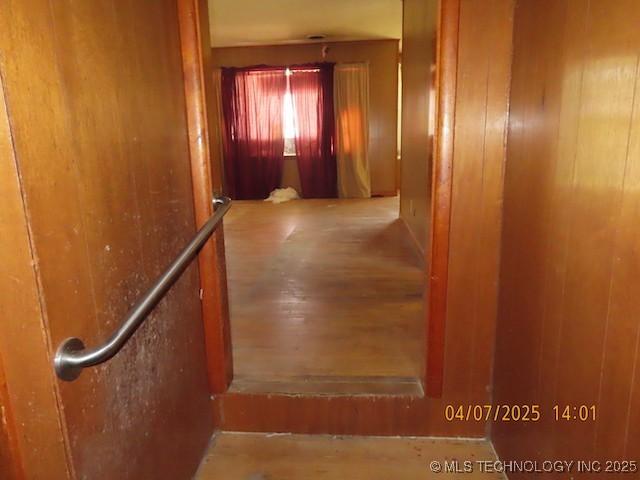 hall with wood finished floors