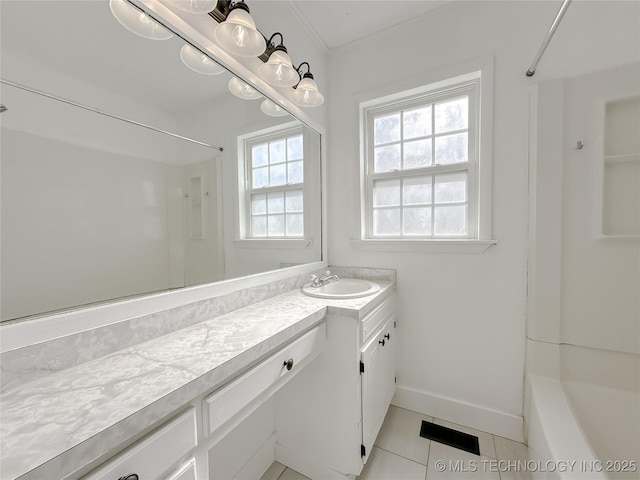 bathroom featuring a shower, visible vents, vanity, baseboards, and tile patterned floors