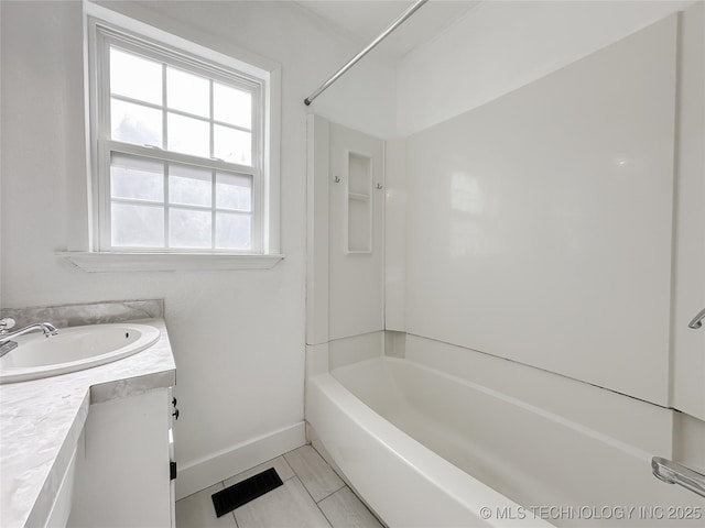 bathroom with vanity, visible vents, baseboards,  shower combination, and tile patterned floors