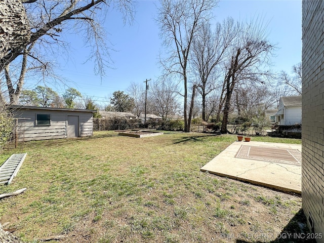 view of yard featuring an outbuilding and a patio area