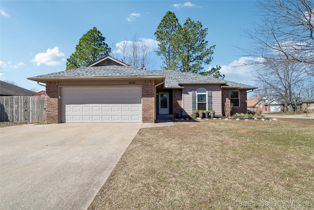 single story home featuring a garage, brick siding, fence, driveway, and a front yard