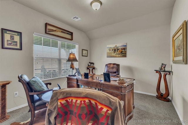 home office featuring lofted ceiling, carpet flooring, visible vents, and baseboards